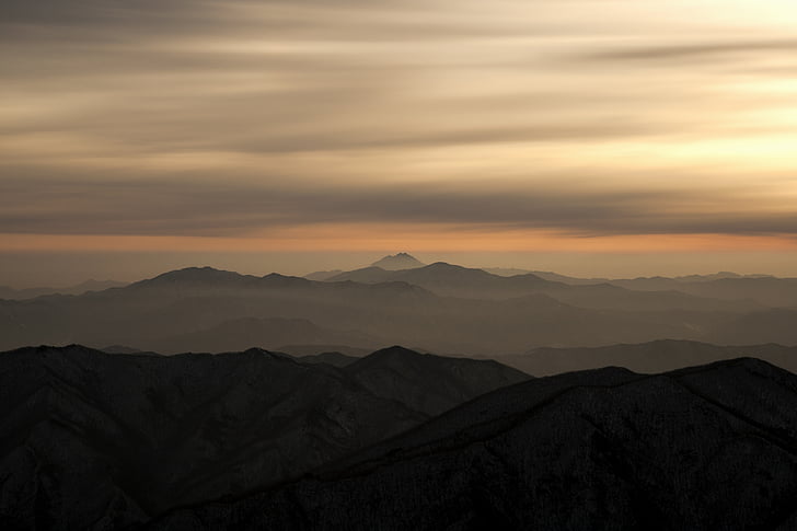 silhouette photo of mountains during golden hour