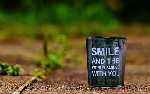 brown and black smile and the world smiles with you-text bucket