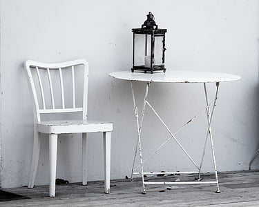 white wooden chair beside round table