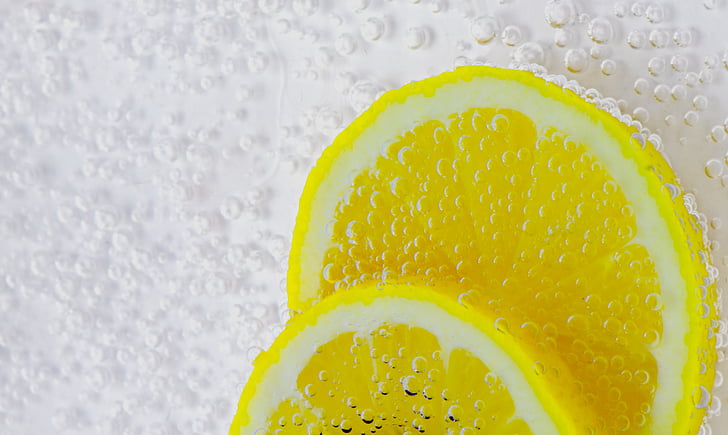 selective focus photography of lemon lime