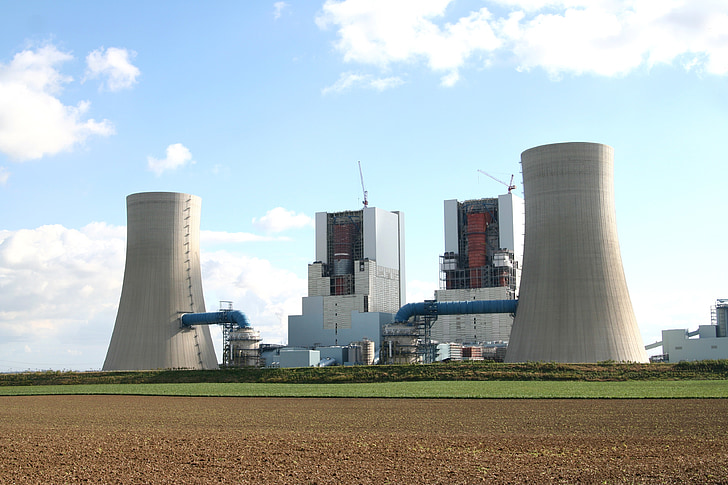 two gray power plant standing next to each other