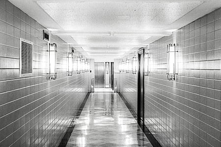 photography of grayscale hallway