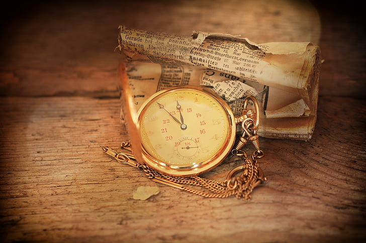 gold-colored pocket watch