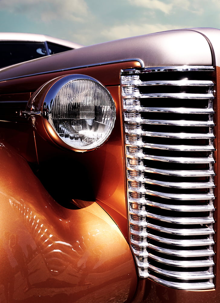 closeup photo of brown vehicle headlight