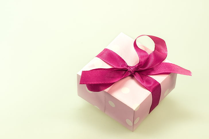 pink and white polka-dot gift box with pink ribbon
