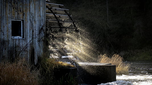 watermill with sun rays wallpaper