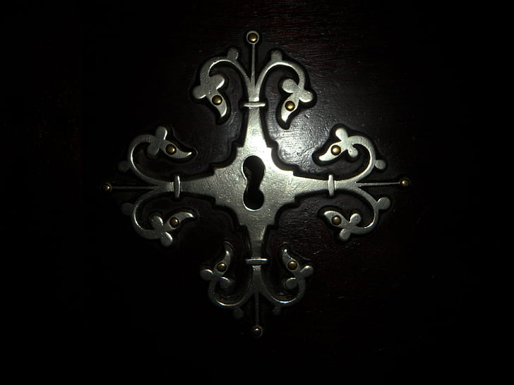 silver metal scrolled key hole