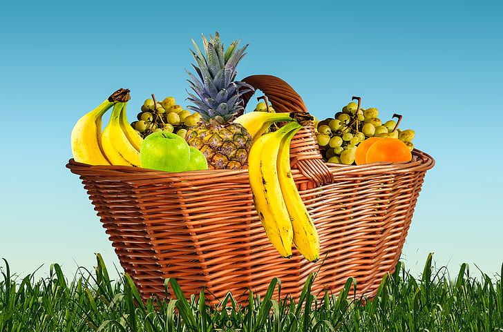 brown wicker basket with assorted fruits