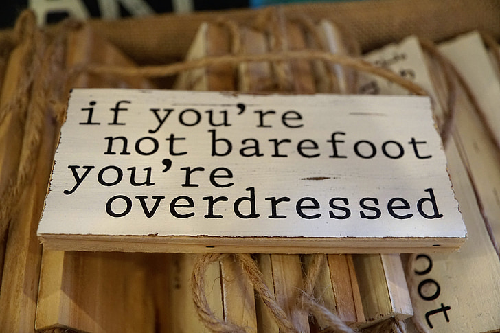 white and brown if you're not barefoot you're overdressed wooden hanging decor