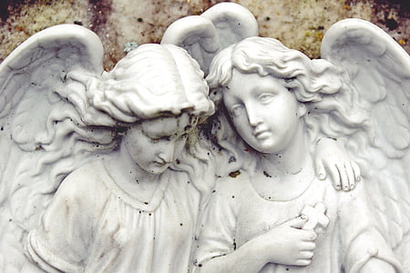 white ceramic angels statue
