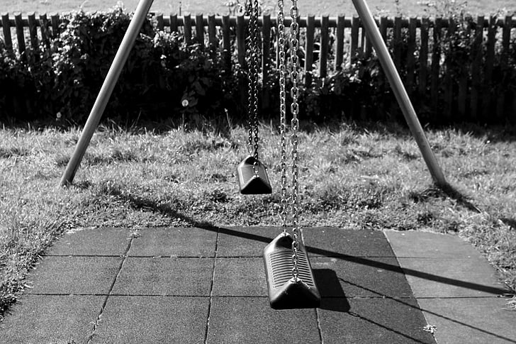 grayscale photography of outdoor swing