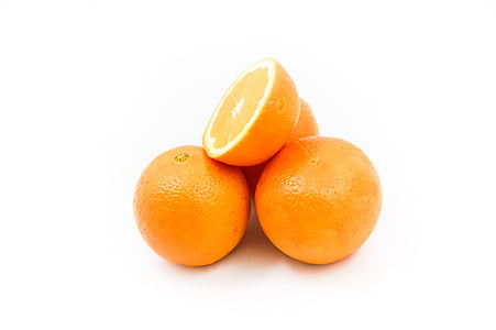 sliced orange on white surfac e