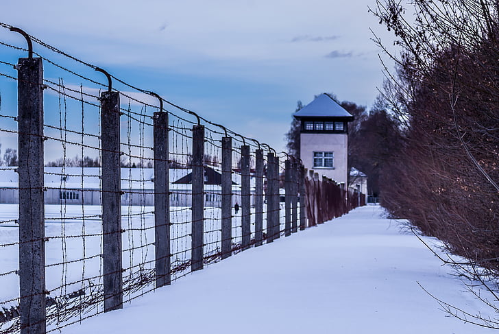 structure enclosed with fence covered in snow