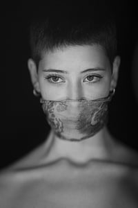 grayscale photo of topless woman wearing mask