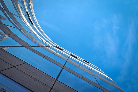low-angle photography of curtain building under blue sky during daytime