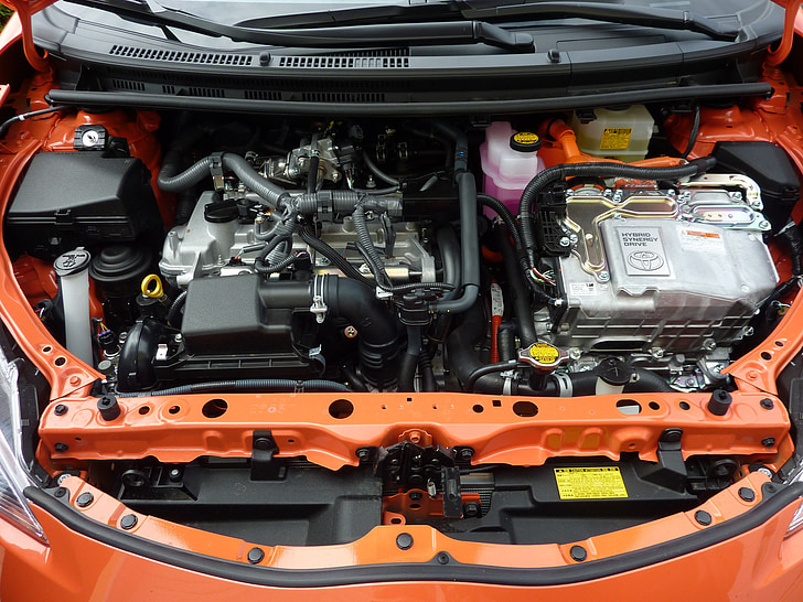 car engine bay of orange car