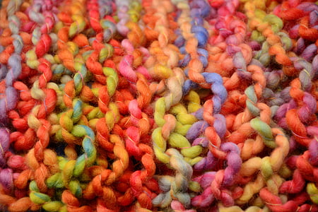 yellow, orange, and pink crochet textile
