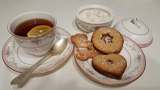 tea and pastry served on saucer and cup