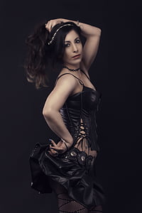 woman in black spaghetti strap dress