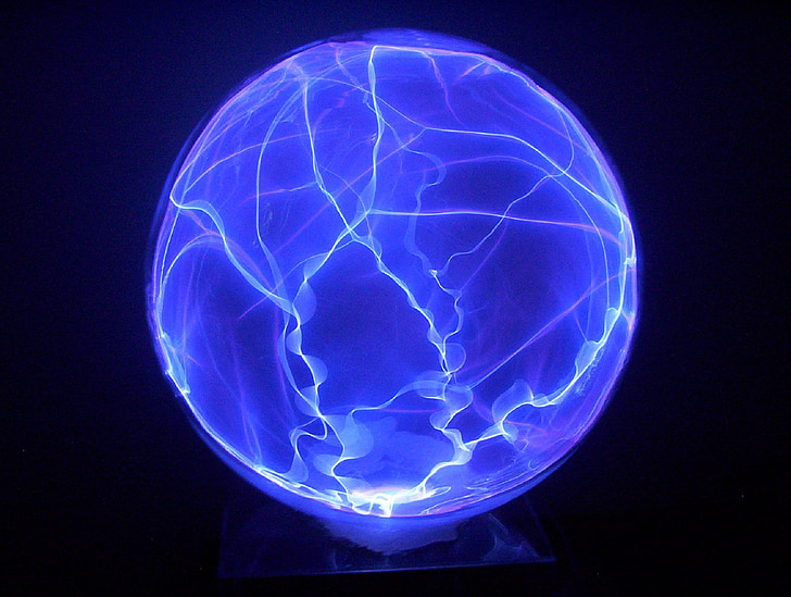 low exposure photo of blue plasma ball