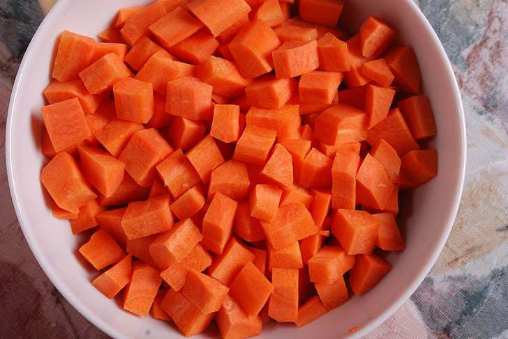 sliced carrots on white ceramic bowl