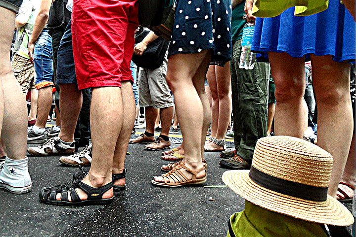 Royalty-Free photo: Calves, legs, human, standing on, stand in line ...