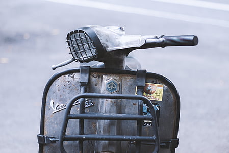 selective photo of gray motor scooter