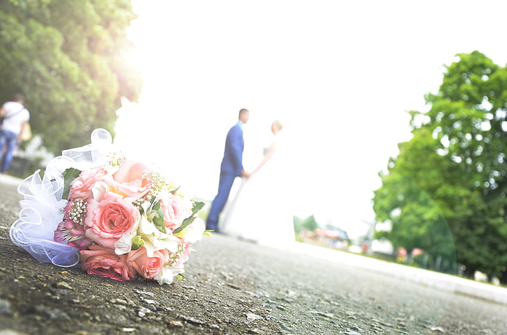 selective focus photo of wedding flower on ground