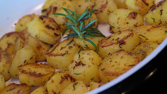 baked potatoes with parsley on ceramic casserole