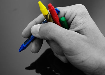 person holding crayons