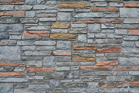 gray and brown concrete brick wall