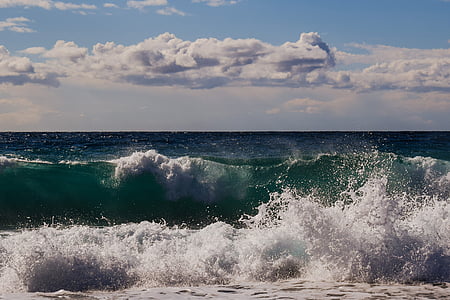 photo of sea waves hitting shore