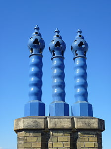 three blue pillars during daytime