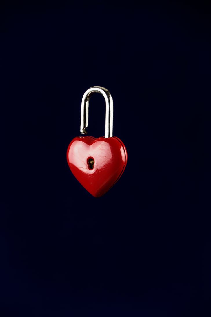 red and silver-colored heart padlock