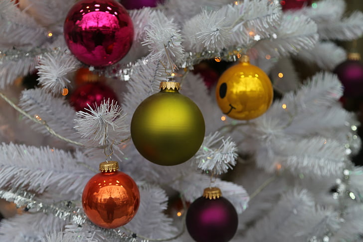 five assorted-color Christmas baubles