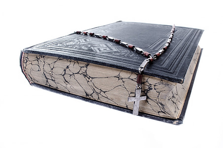 black bible and brown rosary