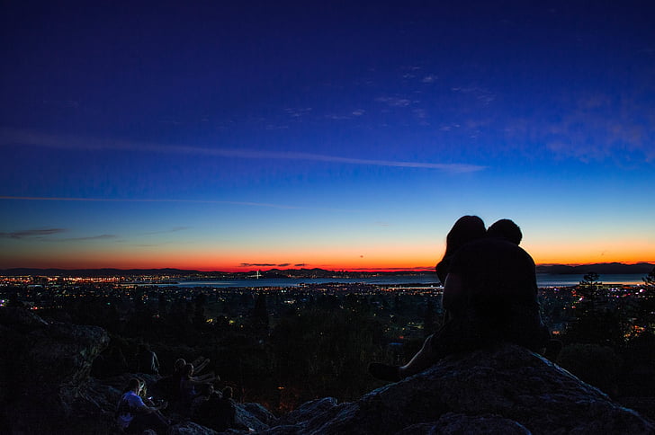 silhouette of two person during nighttime