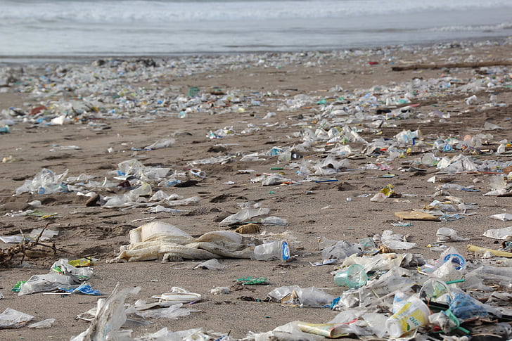 pile of garbage on seashore during daytime