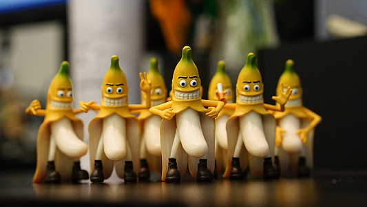 selective focus photography of banana figurines