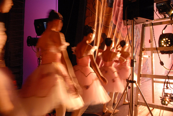 five ballerinas beside stage