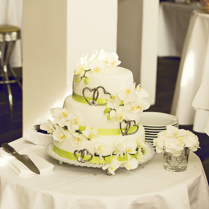 white and green fondant covered cake on table