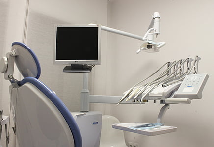 white dentist chair in white wall painted room