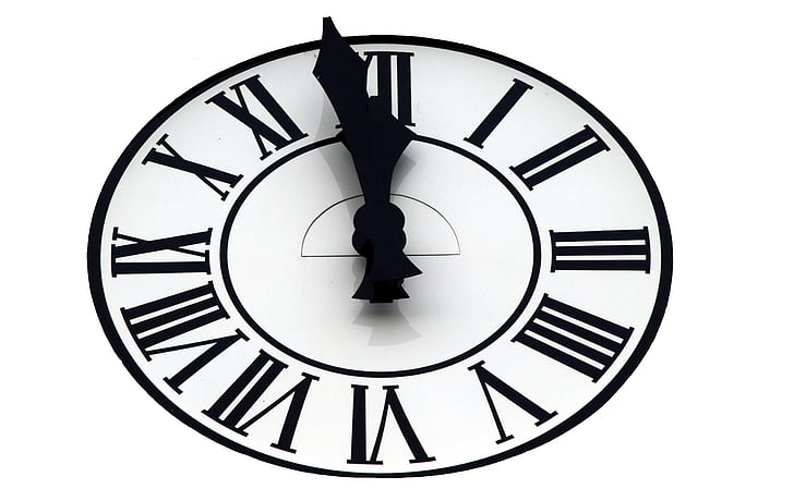 round black analog clock illustration at 11:59