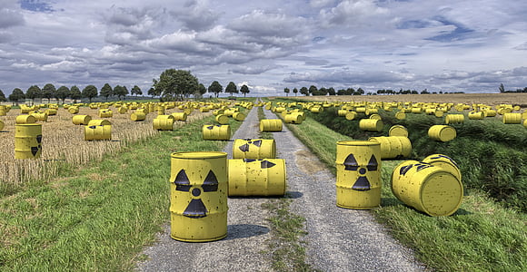 yellow metal tank containers on green grass field