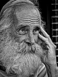 grayscale photo of bearded man
