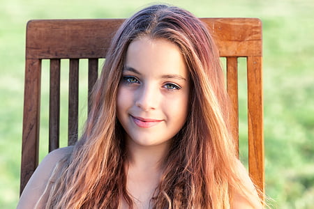 portrait photography of girl with brown hair during daytime
