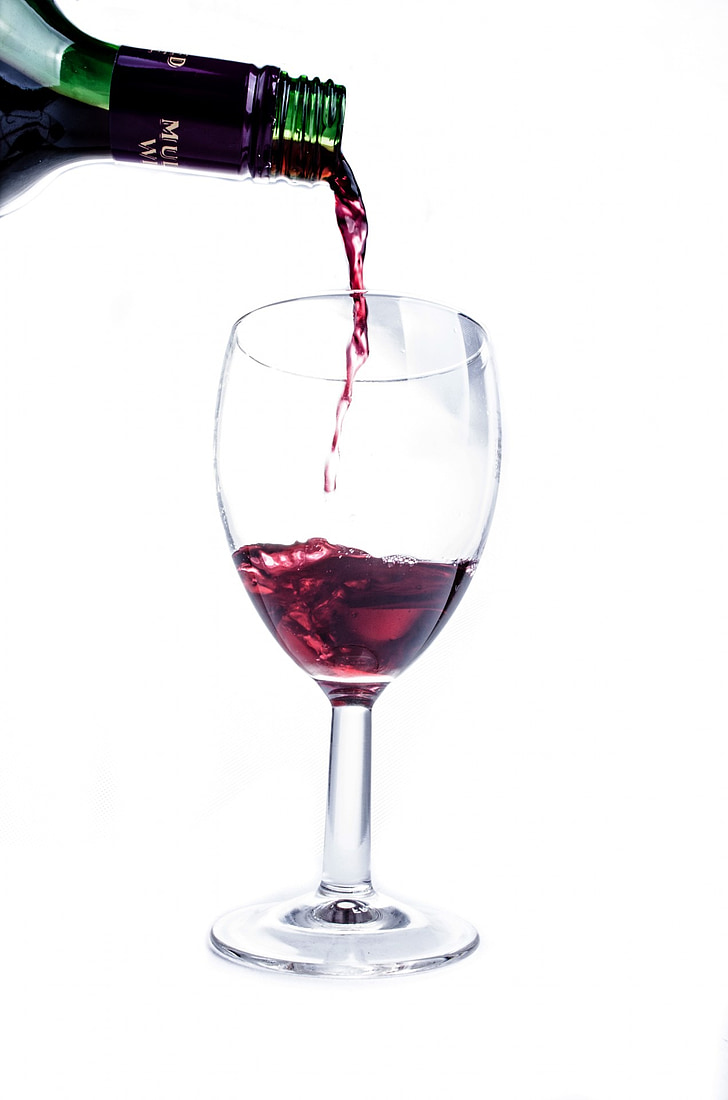 red wine pour on wineglass