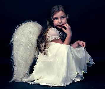 girl in white dress with angel wings