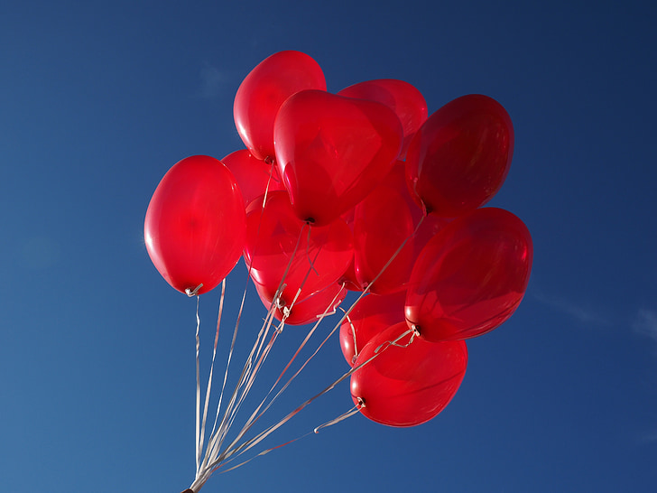 photography of red balloons