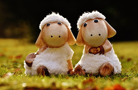 two white sheep figurines